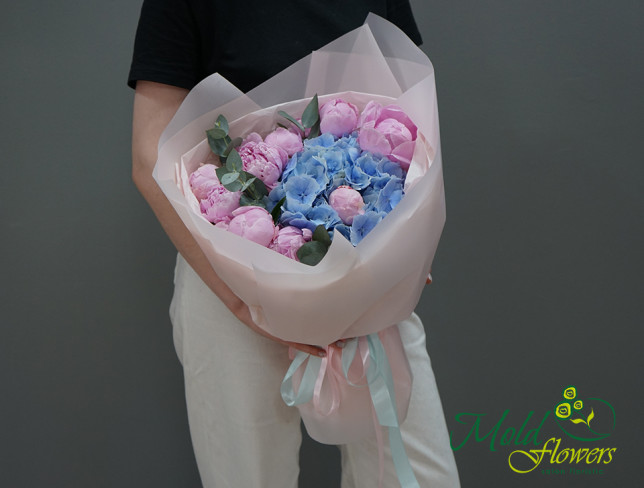 Bouquet of blue hydrangea and pink peonies photo